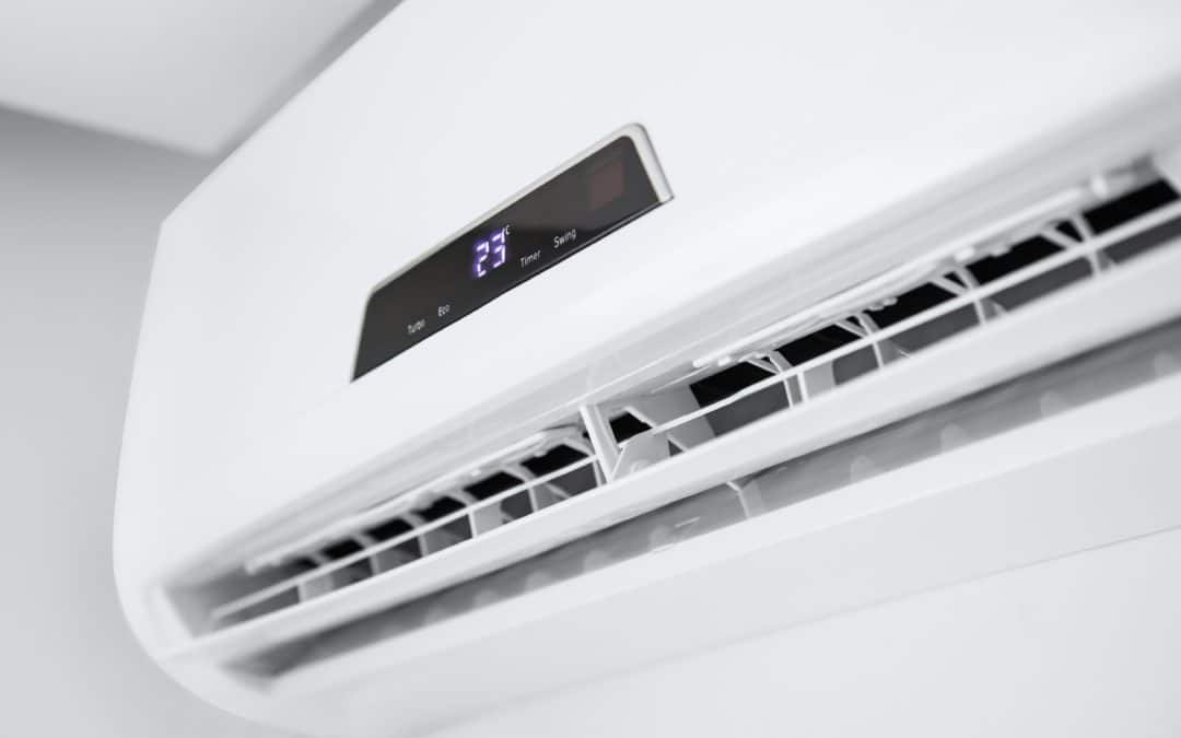Wall-mounted AC displaying the temperature
