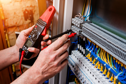 Carini electrician checking electrical panel