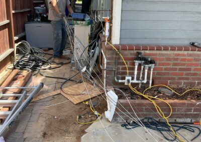running new wires for a home rewire in san diego with an electrician holding wires