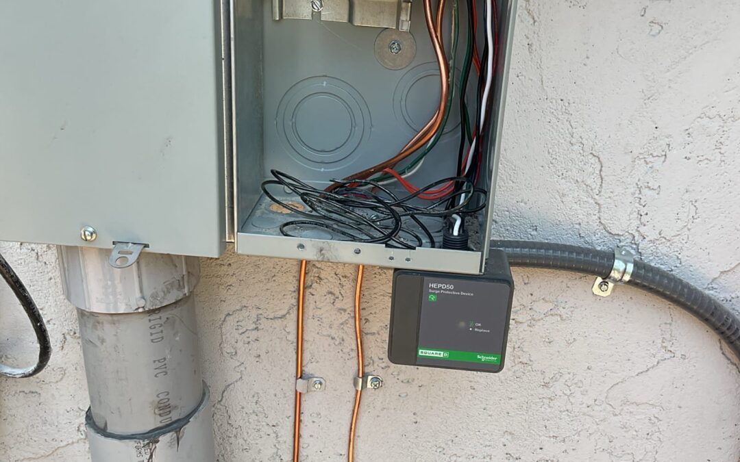 An electrical panel with a surge protector on it